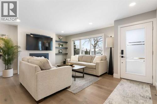 9936 Maplecreek Drive Se, Calgary, AB - Indoor Photo Showing Living Room With Fireplace