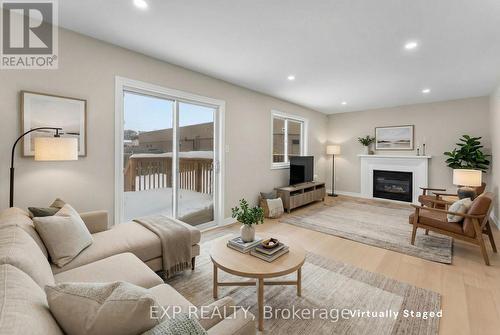 Virtually staged - 8329 Atack Court, Niagara Falls (Ascot), ON - Indoor Photo Showing Living Room With Fireplace