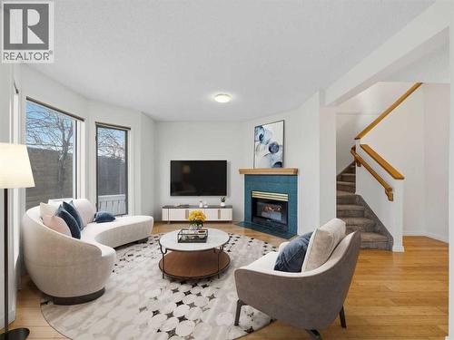 Virtual Staging - 626 Hawkstone Manor Nw, Calgary, AB - Indoor Photo Showing Living Room With Fireplace