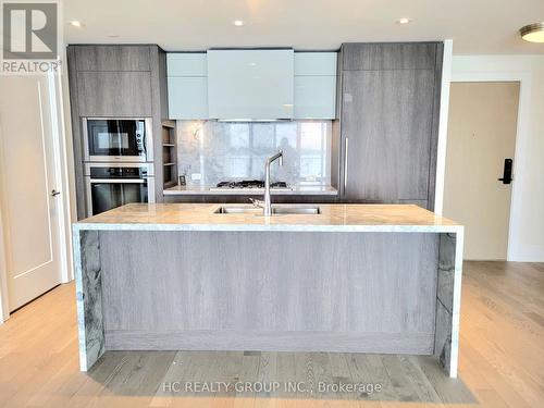 309 - 118 Merchants Wharf Avenue, Toronto, ON - Indoor Photo Showing Kitchen With Double Sink With Upgraded Kitchen