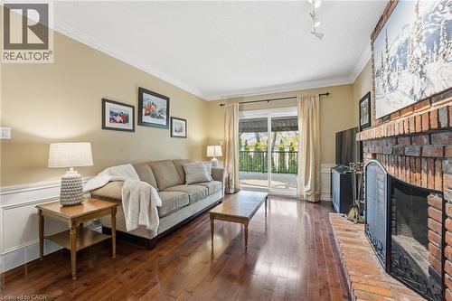 Back family room with view to backyard - 84 Chatterson Drive, Ancaster, ON - Indoor Photo Showing Living Room With Fireplace