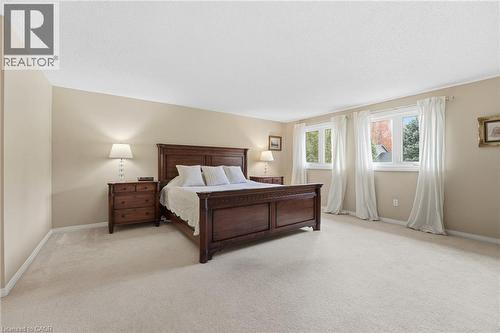 Primary Bedroom with windows to street and dual closets (1 walk-in closet) - 84 Chatterson Drive, Ancaster, ON - Indoor Photo Showing Bedroom