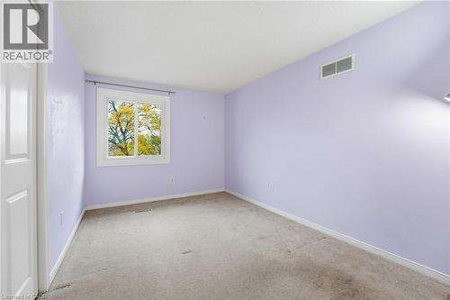 Bedroom facing backyard with closet - 84 Chatterson Drive, Ancaster, ON - Indoor Photo Showing Other Room