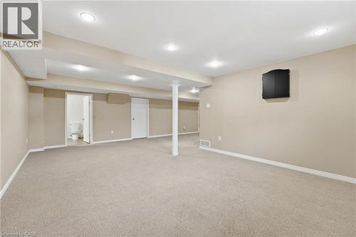 Basement open recreation space with view to storage room and basement bathroom - 84 Chatterson Drive, Ancaster, ON - Indoor Photo Showing Basement