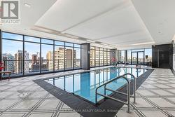 Indoor pool with a city view - 