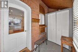 Side entrance mud room with a double closet. - 