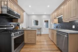 Stainless steel appliances include gas stove - 