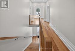 Hardwood stairs & railing to 2nd floor landing - 