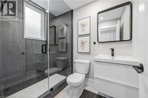 main floor Bathroom featuring vanity and a marble finish shower - 248 Wales Crescent, Oakville, ON - Indoor Photo Showing Bathroom