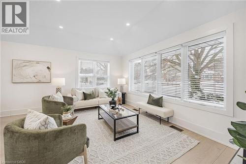 Living area featuring vaulted ceiling, recessed lighting, and light wood-type flooring - 248 Wales Crescent, Oakville, ON - Indoor Photo Showing Living Room