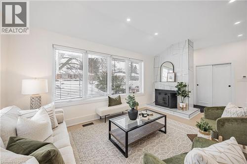 Living room featuring lofted ceiling, recessed lighting, and wood finished floors - 248 Wales Crescent, Oakville, ON - Indoor Photo Showing Living Room With Fireplace
