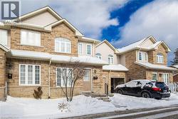 View of front facade featuring stone siding - 