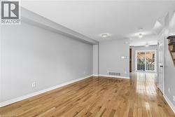 Empty room featuring light wood-type flooring and baseboards - 