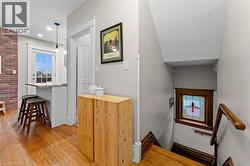 Staircase featuring wood finished floors - 