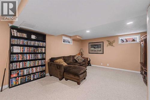 TV area - 6331 Falton Road Ne, Calgary, AB - Indoor Photo Showing Basement