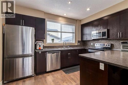 152 New Brighton Grove Se, Calgary, AB - Indoor Photo Showing Kitchen With Double Sink