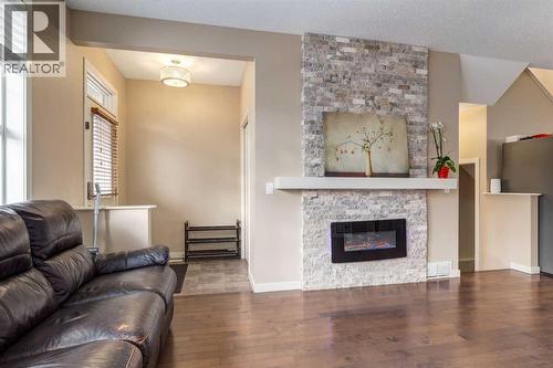 152 New Brighton Grove Se, Calgary, AB - Indoor Photo Showing Living Room With Fireplace