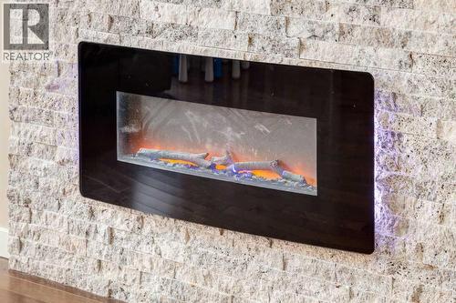 152 New Brighton Grove Se, Calgary, AB - Indoor With Fireplace