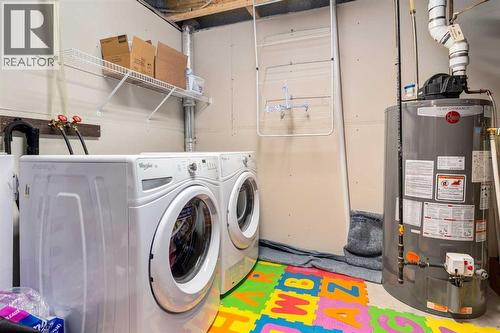 152 New Brighton Grove Se, Calgary, AB - Indoor Photo Showing Laundry Room