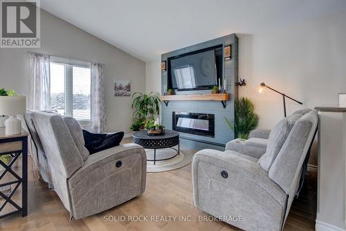 3645 Murvale Road, Frontenac (Frontenac South), ON - Indoor Photo Showing Living Room With Fireplace