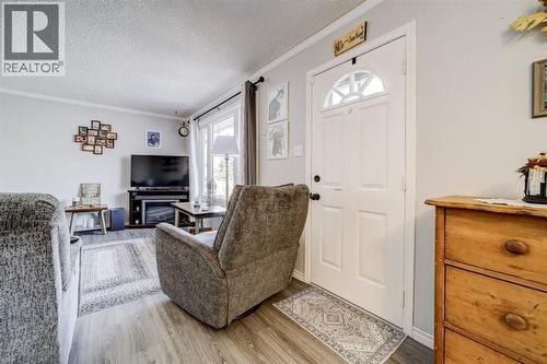 Living Room/Front Entrance - 1510 12 Avenue N, Lethbridge, AB - Indoor Photo Showing Living Room