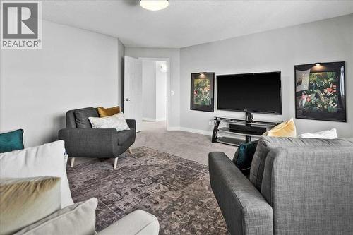 255 Gleneagles View, Cochrane, AB - Indoor Photo Showing Living Room