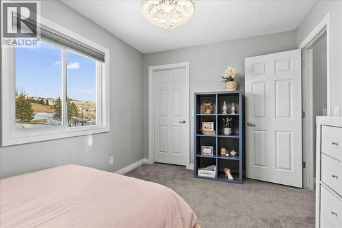 255 Gleneagles View, Cochrane, AB - Indoor Photo Showing Bedroom