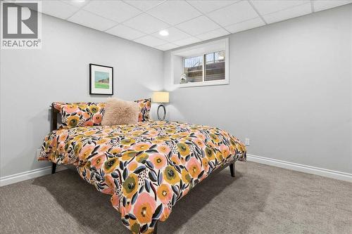 4th bedroom lower level - 255 Gleneagles View, Cochrane, AB - Indoor Photo Showing Bedroom