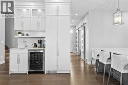 Coffee bar and wine fridge. Oversized pantry with pullout dawers - 