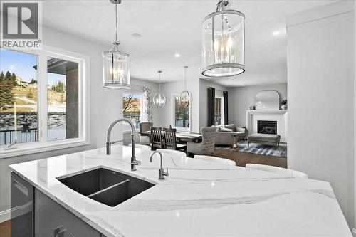 Large quartz island - 255 Gleneagles View, Cochrane, AB - Indoor Photo Showing Kitchen With Double Sink