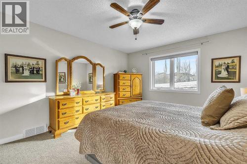 103 Panamount Crescent Nw, Calgary, AB - Indoor Photo Showing Bedroom