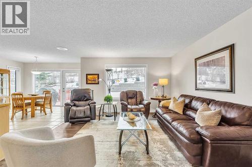 103 Panamount Crescent Nw, Calgary, AB - Indoor Photo Showing Living Room