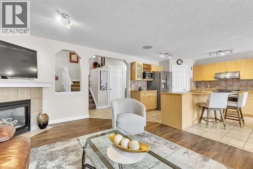 103 Panamount Crescent Nw, Calgary, AB - Indoor With Fireplace