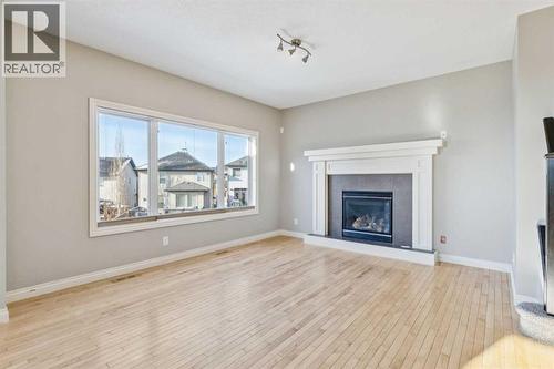 Living Area - 110 Heritage Place Ne, Cochrane, AB - Indoor Photo Showing Living Room With Fireplace