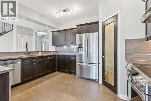 Kitchen - 110 Heritage Place Ne, Cochrane, AB - Indoor Photo Showing Kitchen With Upgraded Kitchen