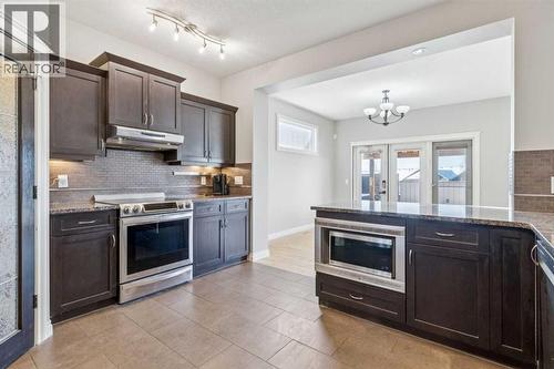 Kitchen #2 - 110 Heritage Place Ne, Cochrane, AB - Indoor Photo Showing Kitchen With Upgraded Kitchen