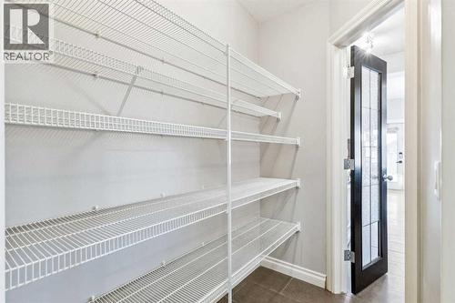 Walk Through Pantry - 110 Heritage Place Ne, Cochrane, AB - Indoor With Storage