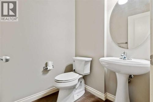 Main Powder Room - 110 Heritage Place Ne, Cochrane, AB - Indoor Photo Showing Bathroom