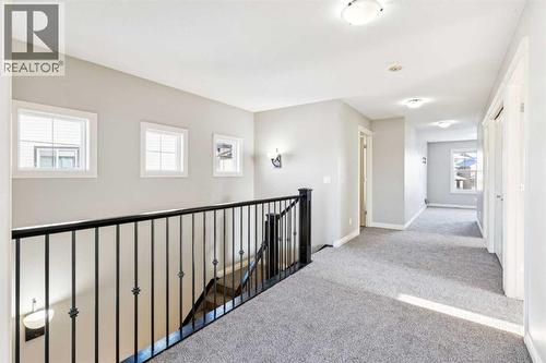 Hallway on Top Floor - 110 Heritage Place Ne, Cochrane, AB - Indoor Photo Showing Other Room