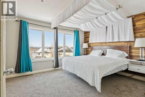 Master Suite - 110 Heritage Place Ne, Cochrane, AB - Indoor Photo Showing Bedroom