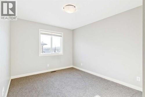 Spare Room - 110 Heritage Place Ne, Cochrane, AB - Indoor Photo Showing Other Room