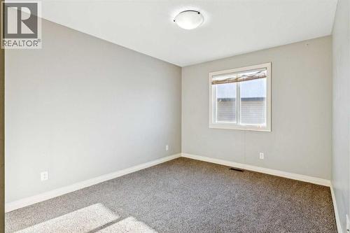 3rd Bedroom - 110 Heritage Place Ne, Cochrane, AB - Indoor Photo Showing Other Room