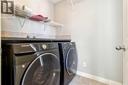 Laundry Room Upstairs - 110 Heritage Place Ne, Cochrane, AB - Indoor Photo Showing Laundry Room
