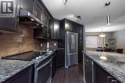 54 Cranford Bay Se, Calgary, AB - Indoor Photo Showing Kitchen With Upgraded Kitchen