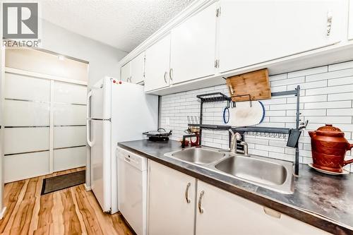306, 1712 38 Street Se, Calgary, AB - Indoor Photo Showing Kitchen With Double Sink