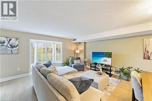 Flooded with natural light - 216 Plains Road W Unit# B403, Burlington, ON - Indoor Photo Showing Living Room