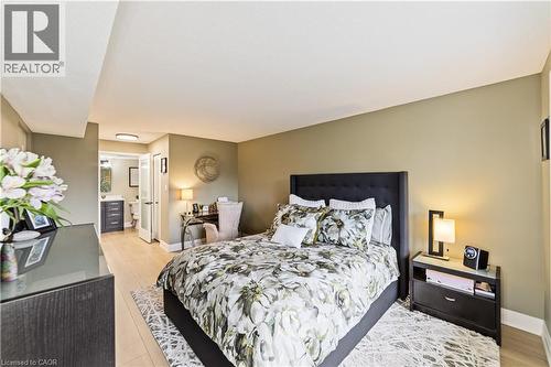 With both walk in AND double closet - 216 Plains Road W Unit# B403, Burlington, ON - Indoor Photo Showing Bedroom