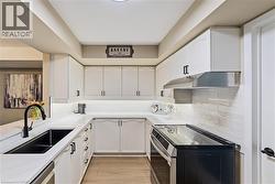 Updated kitchen features  classic white cabinetry - 