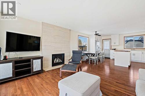 108 Lynnbrook Bay Se, Calgary, AB - Indoor Photo Showing Living Room With Fireplace