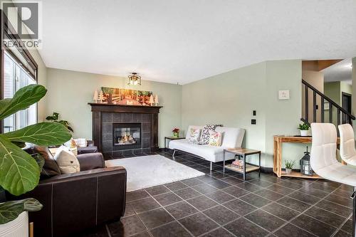 6 Westmount Circle, Okotoks, AB - Indoor Photo Showing Living Room With Fireplace